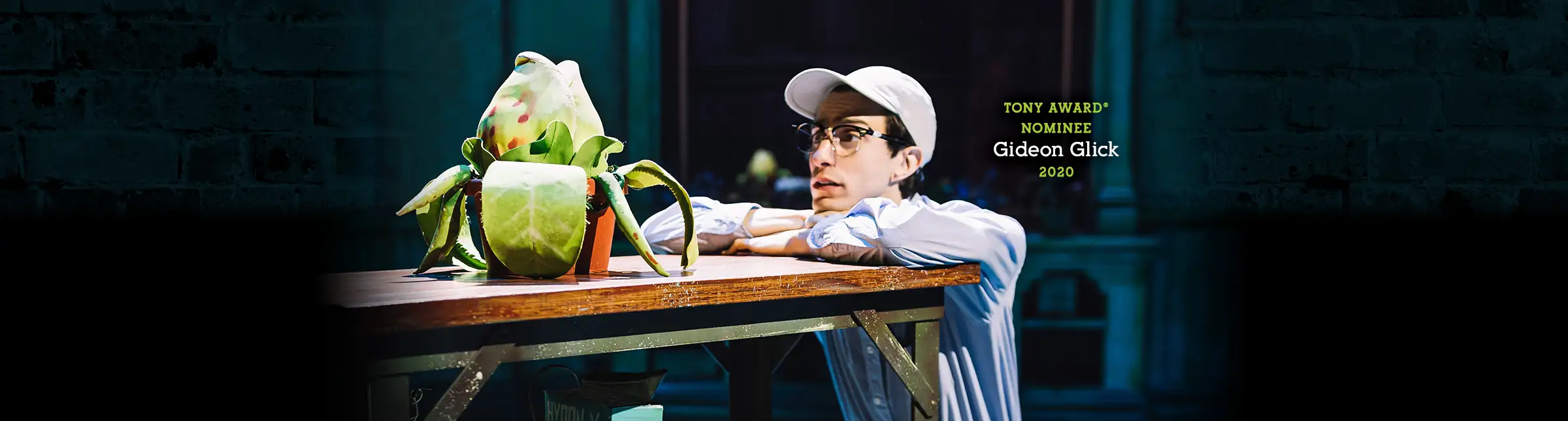Tony Award nominee Gideon Glick in the 2020 Broadway cast of Little Shop of Horrors, performing with the Audrey II plant.